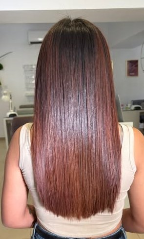 Sleek, glossy copper-brown hair
